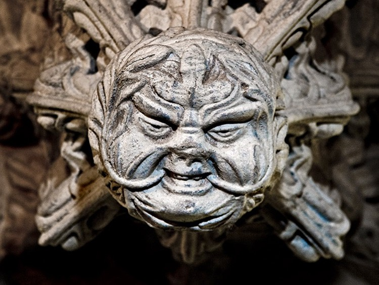 Stone carving of a Green Man figure with detailed foliage at Rosslyn Chapel.